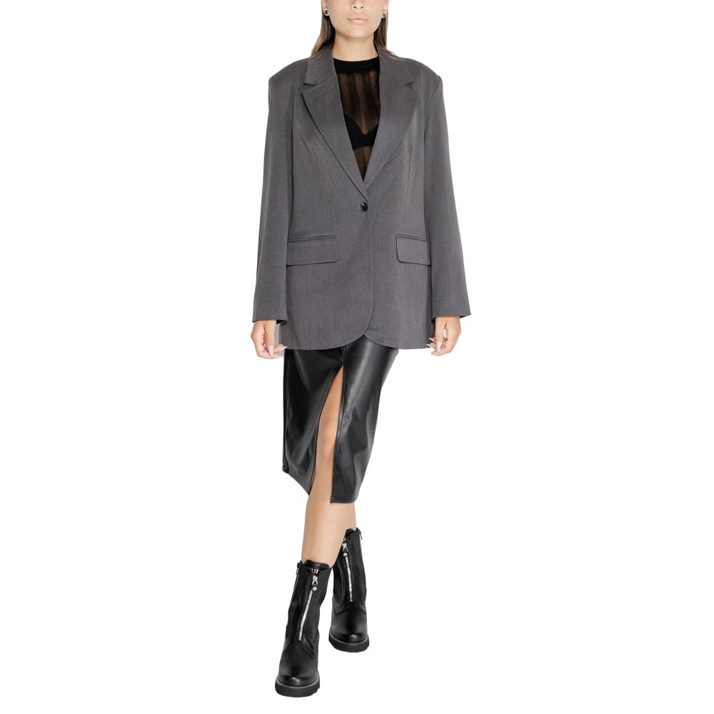 Woman wearing Only Gray Recycled Polyester Blazer, part of women's fall/winter collection, made with eco-friendly materials.