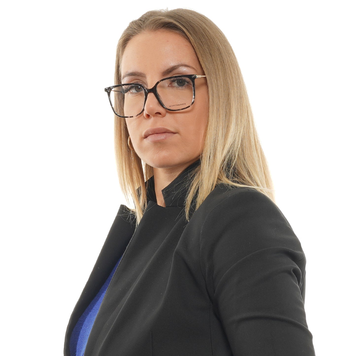 Professional woman wearing glasses and a blazer looking confidently forward.