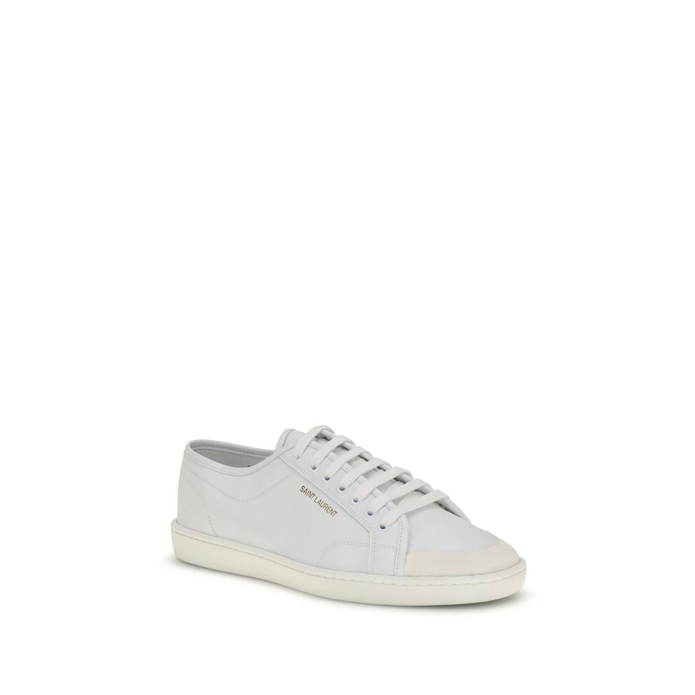 Saint Laurent White Calf Leather Bos Taurus Low Top Sneakers with gold logo and rubber sole.