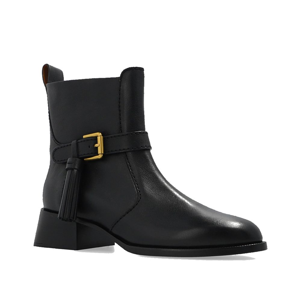 See By Chloé Black Calfskin Ankle Boots with leather lining, rubber sole, side zip, adjustable strap, made in Spain.