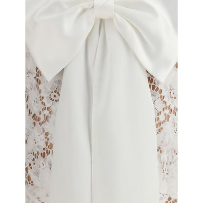 Close-up of white lace and oversized satin bow on Self-Portrait White Nylon Casual Dress with U-shaped back neckline, AW25 collection.
