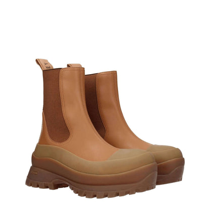 Stella McCartney Brown Leather Ankle Boots with rubber sole, eco leather, and back logo. Casual style with mid heels and round toe.
