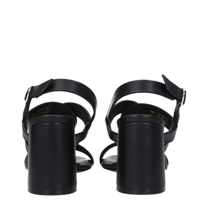 Rear view of Stuart Weitzman Black Leather Platform Sandals with buckle closure and mid heels.