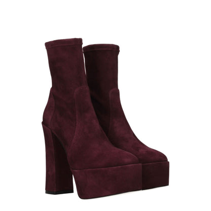 Stuart Weitzman Purple Leather Ankle Boots with high heel and round toe, suede material, casual style, and cordovan color accents.