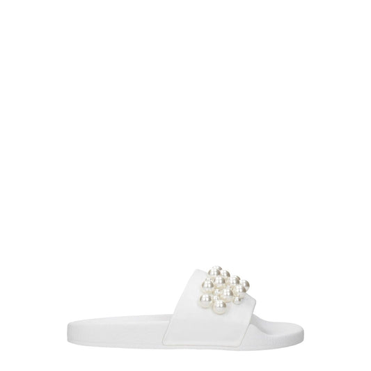 Stuart Weitzman White Leather Slippers with pearl detail, featuring open toe and flat sole, perfect for street style.