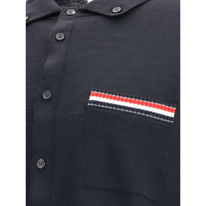 Close-up of Thom Browne Black Fleece Wool Sweatshirt featuring tricolor pocket detail and button closure.