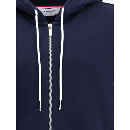 Close-up of Thom Browne Blue Cotton Sweatshirt with drawstring hood and front zipper, showcasing distinctive contrasting details.