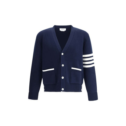 Thom Browne Blue Merino Wool Cardigan with V-neck, front button closure, ribbed hem, and contrasting sleeve bands.