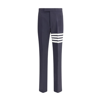 Thom Browne Blue Wool Dress Pants with iconic stripe detail, featuring side slash and back welt pockets, ideal for a formal look.