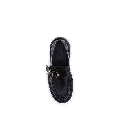 Top view of Tod's Black Rubber Platform Loafers with metal ring embellishment on soft nappa leather, featuring a contemporary design.