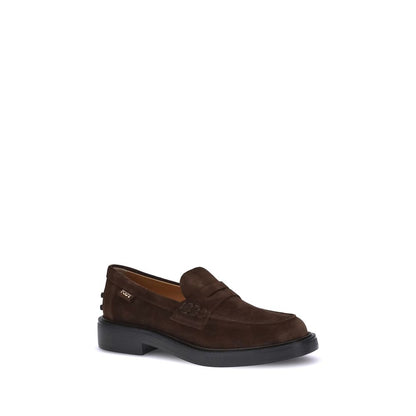 Tod's Brown Rubber Slip-On Loafers with hand-stitched detailing and rubber pebble heel, showcasing timeless elegance and authenticity.