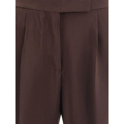 Close-up of Tom Ford Brown Viscose Casual Pants with side welt pockets and back pockets, featuring wide leg and hook-and-eye closure.