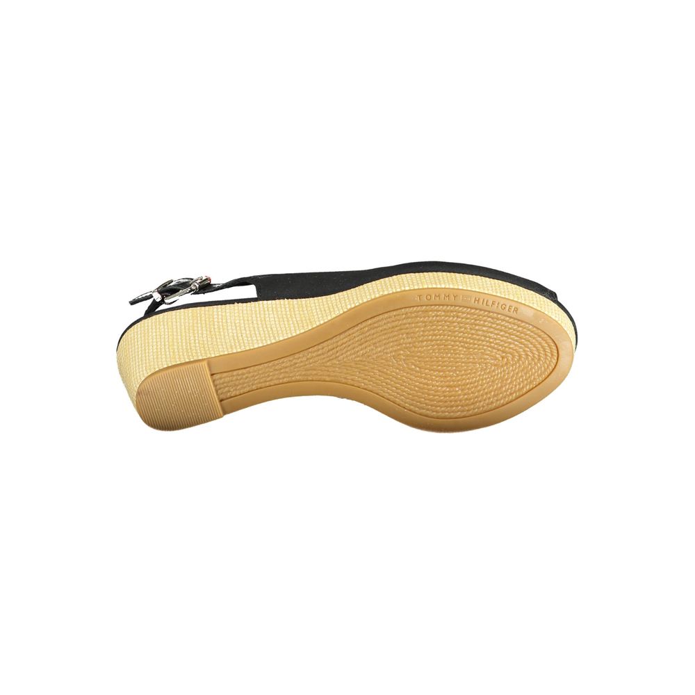 Sole view of Tommy Hilfiger Black Leather Women Sandal with logo, showcasing rubber material and stylish design.