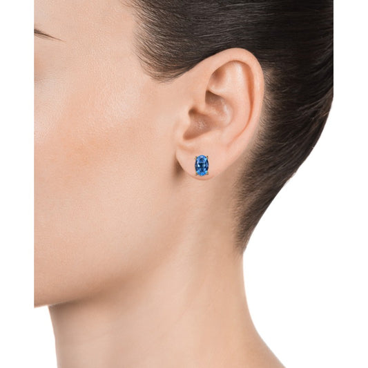 Close-up of a woman wearing VICEROY JEWELS Mod. 13129E100-53 silver 925° earrings with blue gemstones, elegant and stylish design.