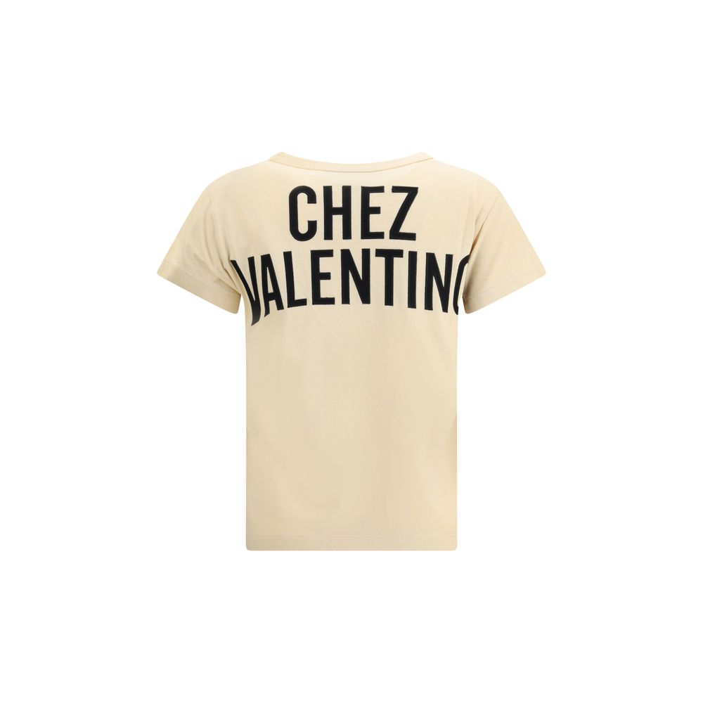 Back view of Valentino Beige Cotton T-Shirt with 'CHEZ VALENTINO' print, ribbed crew neck, 100% cotton, AW25 collection.