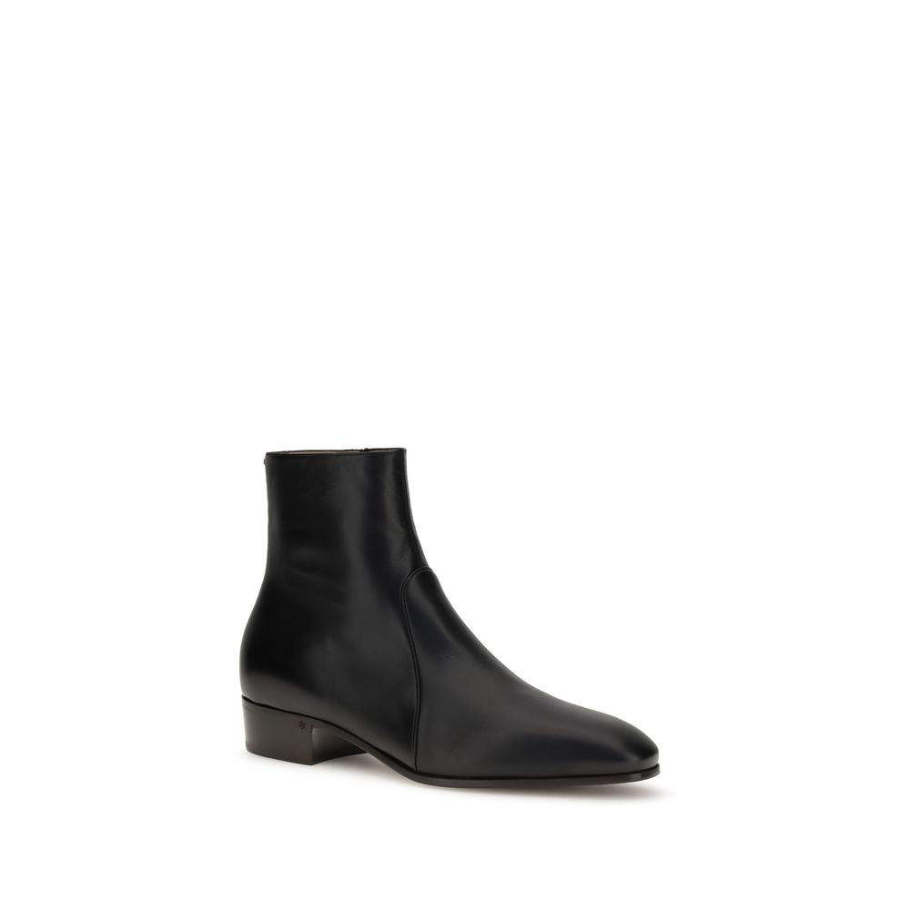 Valentino Garavani Black Goatskin Ankle Boots featuring VLogo detail and leather sole, showcasing elegant craftsmanship and versatility.