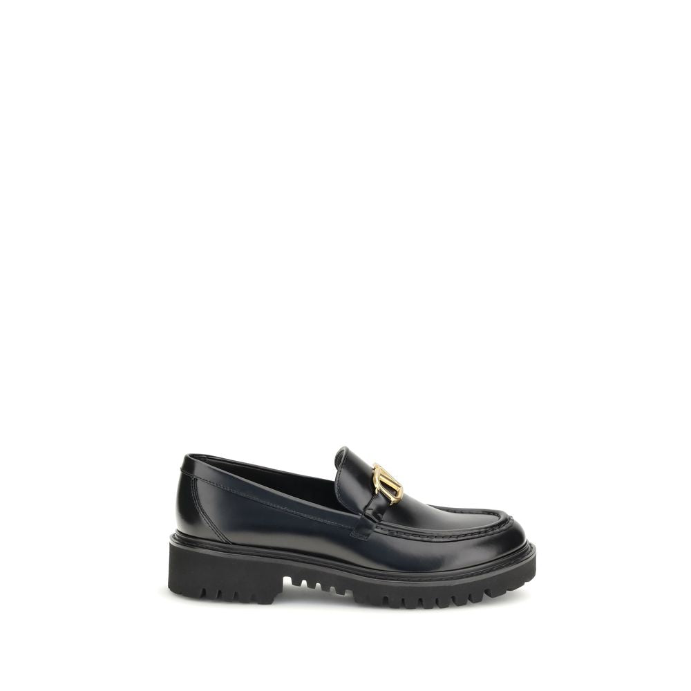 Valentino Garavani Black Leather Slip-On Loafers with VLogo detail and rubber lug sole.