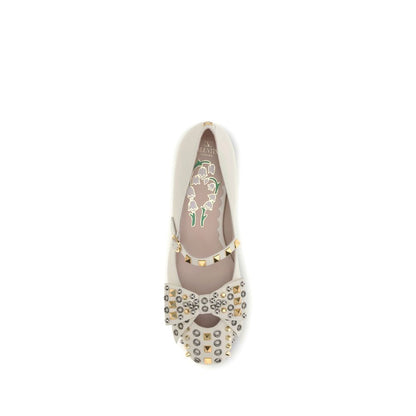Valentino Garavani Cream Goatskin Ballet Flats with bow and eyelet stud design, featuring VLogo and floral-patterned footbed.