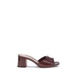 Valentino Garavani Vlogo slide Sandals in glossy patent leather with iconic VLogo, showcasing elegant and minimalistic design for AW25.
