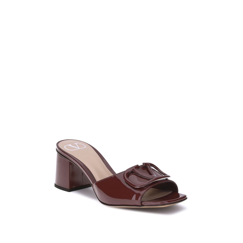 Valentino Garavani Vlogo slide Sandals in glossy patent leather with Signature VLogo on wide heel, minimalistic design, AW25.